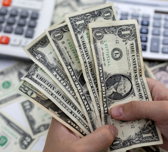 Money in paper form  six bills consisting of 4 dollars a 2 dollar bill and a 20 dollar bill
